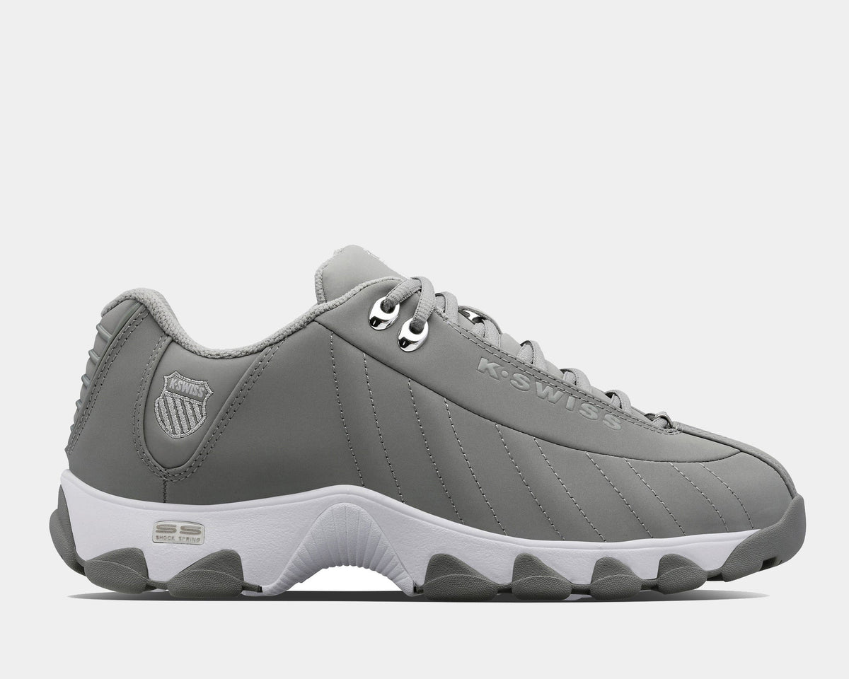 A white K-Swiss ST329 CMF sneaker with a leather upper, a rubber outsole, and a lace closure.