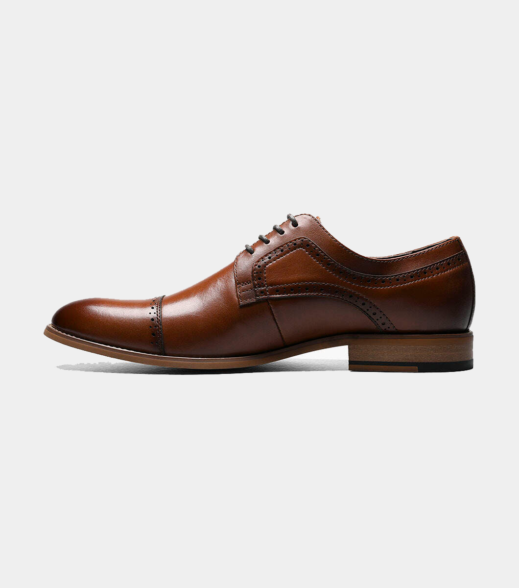 Stacy Adams Dickinson Cap Toe dress shoe in rich brown leather with brogue detailing and stacked wooden heel, side view.