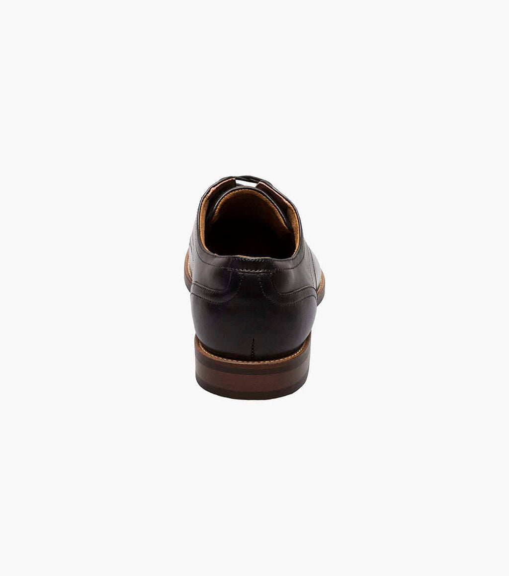 Florsheim Rucci Cap Oxford dress shoes in black leather with a brown stacked heel, back view showing heel detail.