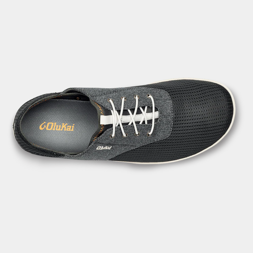 OluKai Nohea Moku shoes in dark gray with breathable mesh upper, white laces, and cushioned insole, top view.