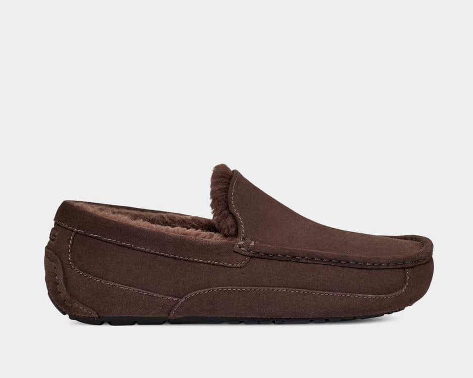 UGG Ascot Suede slippers in brown suede with stitched details and plush lining, side view.