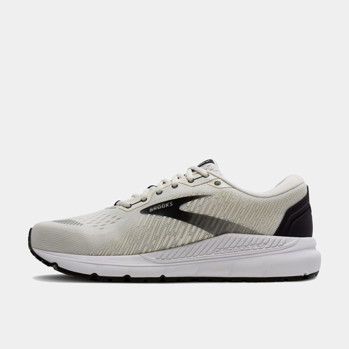 Brooks Addiction GTS 15 running shoes in cream and black with GuideRails support and textured mesh upper, side view.