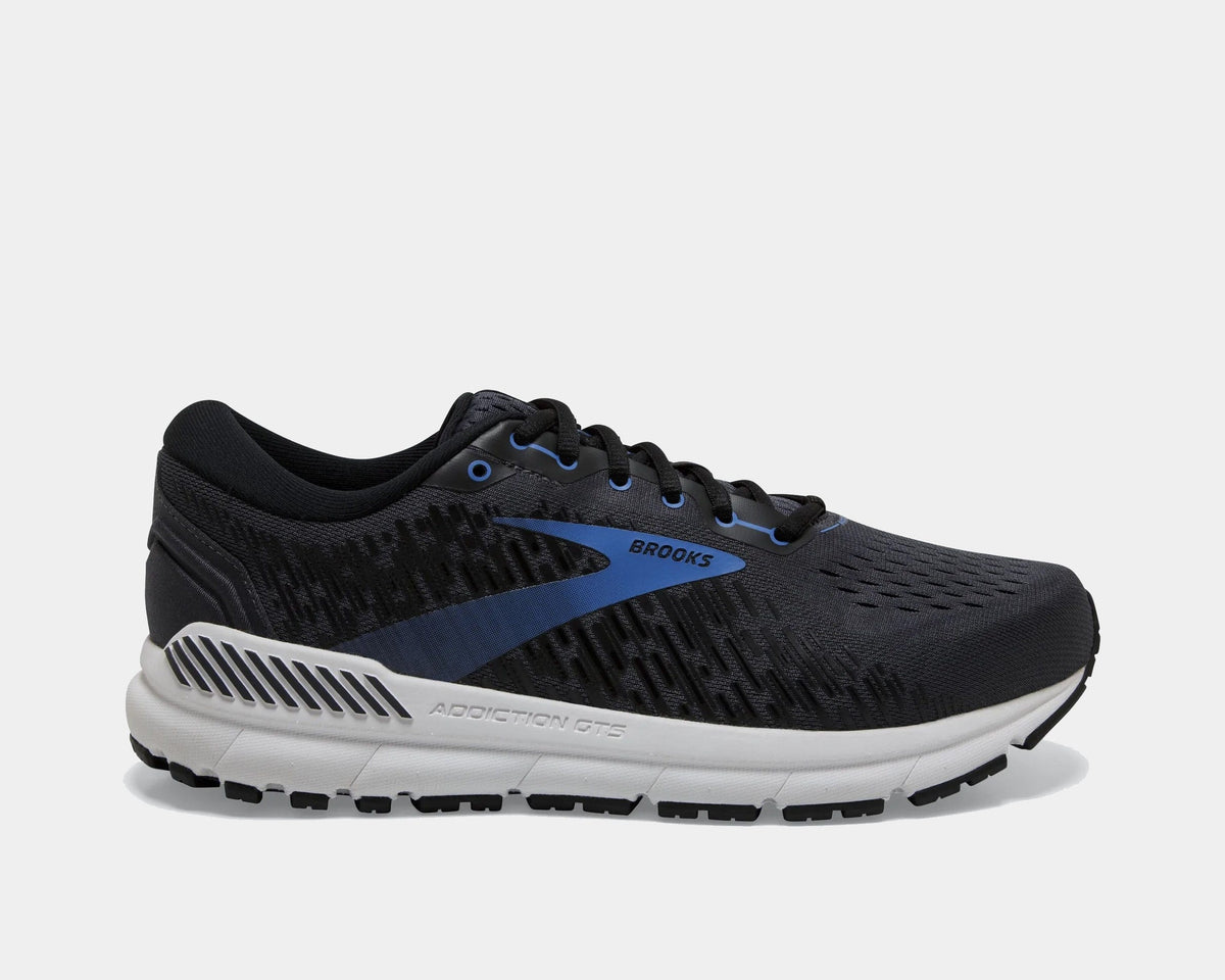 Brooks Addiction GTS 15 running shoes in black with blue accents, GuideRails support system, and mesh upper, side view.