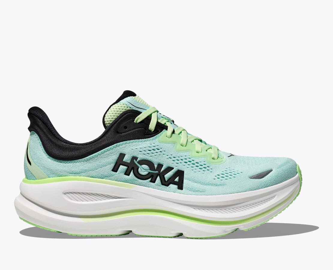 HOKA Bondi 9 running shoes in light green with black detailing, breathable mesh upper, and thick cushioned sole, side view.