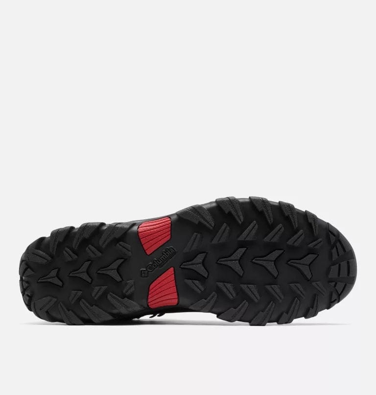 Columbia Newton Ridge Plus II Waterproof hiking boots outsole in black rubber with deep tread pattern and red accents, bottom view.