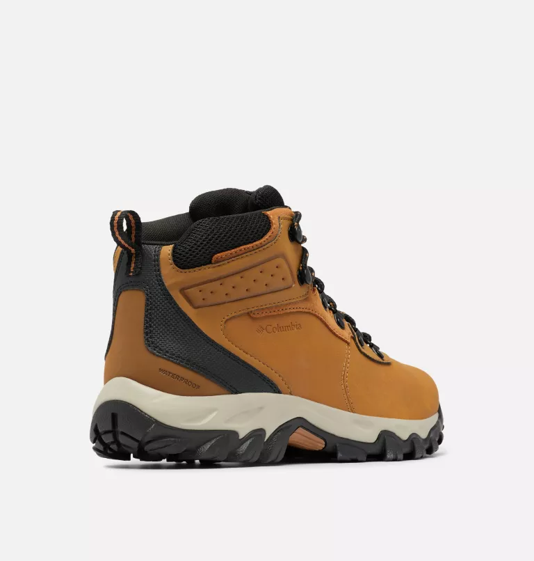 Columbia Newton Ridge Plus II Waterproof hiking boots in golden tan and black with a durable leather upper, padded collar, and rugged outsole, side view.