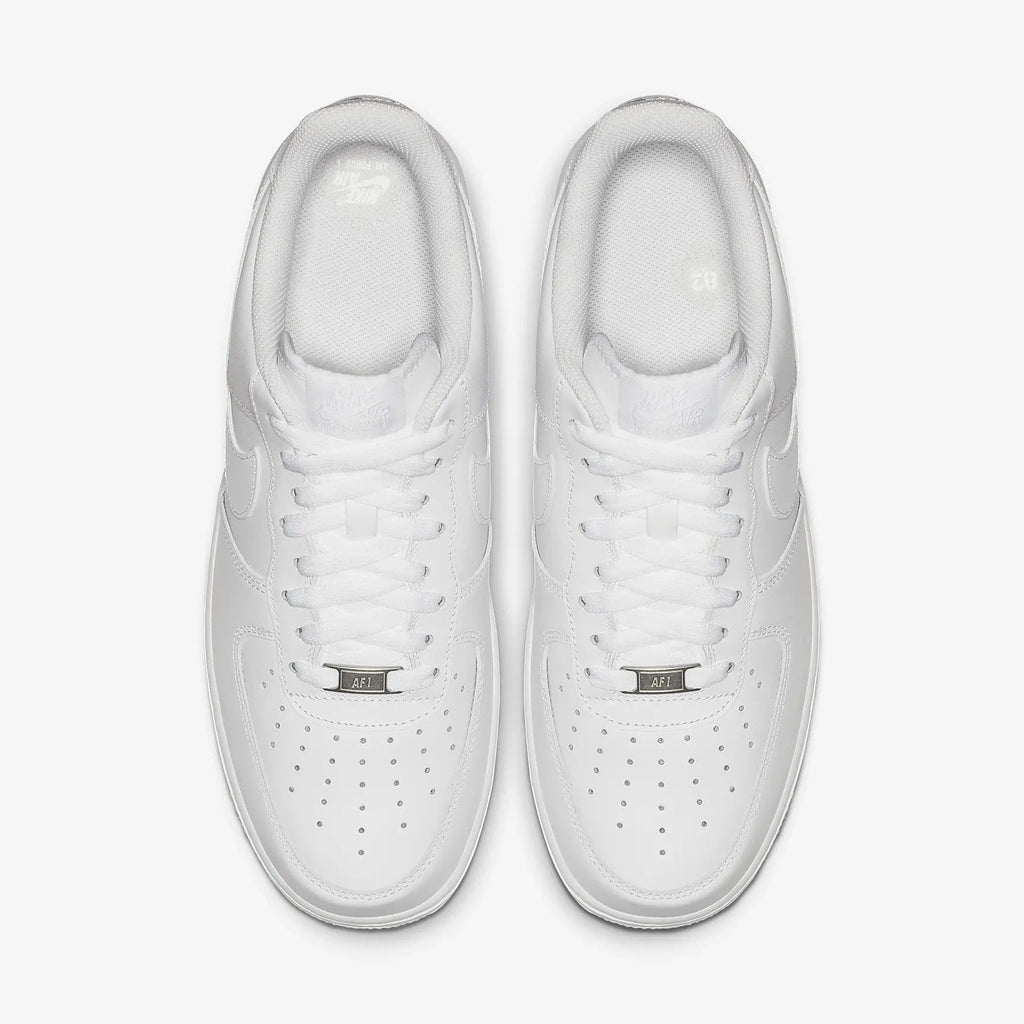 Nike Air Force 1 '07 sneakers in white leather with perforated toe box and lace design, top view.
