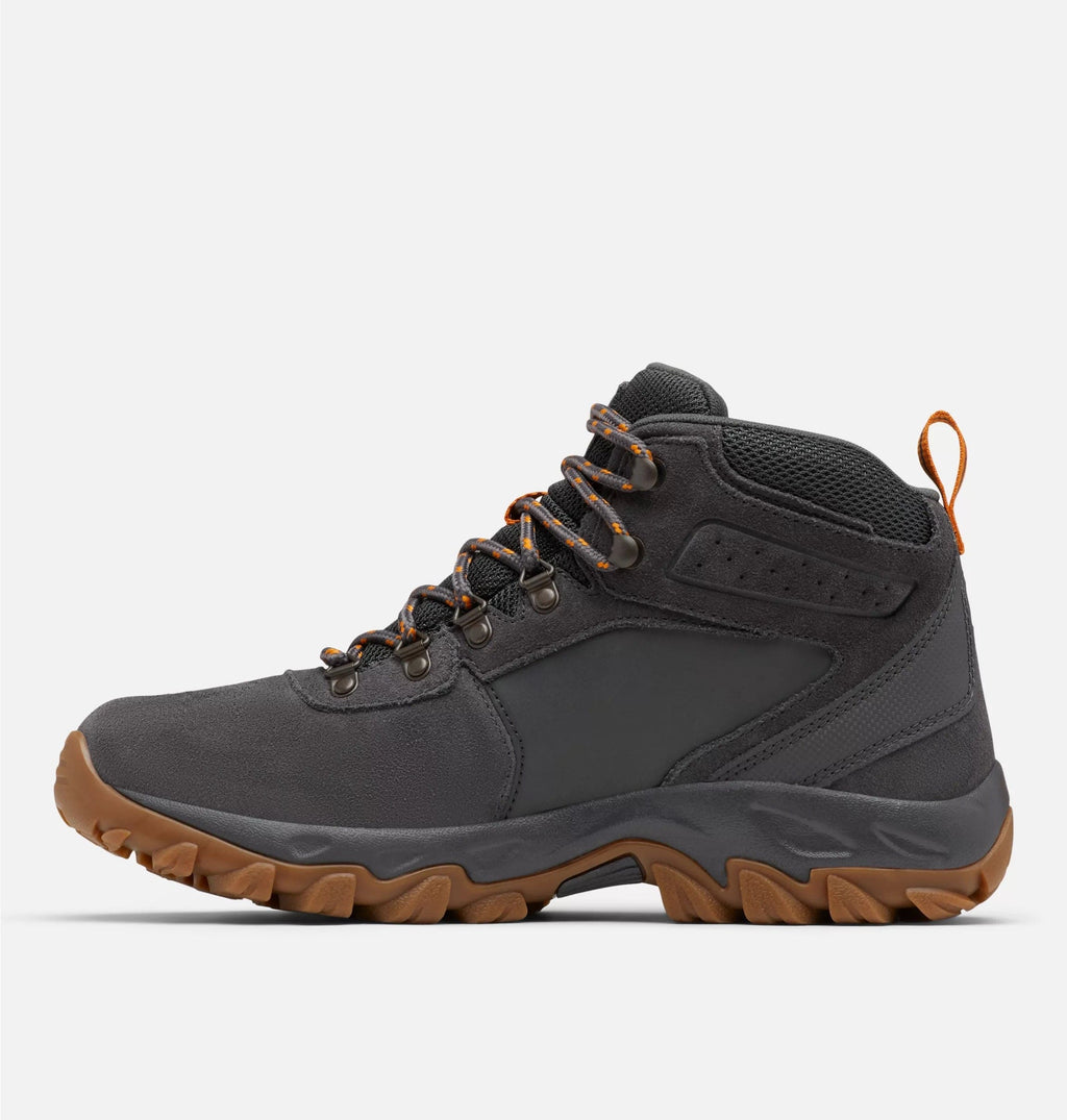 Columbia Newton Ridge Plus II Suede WP hiking boots in dark gray suede with orange accents and rugged brown outsole, side view.
