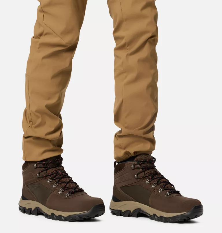 Columbia Newton Ridge Plus II Suede WP hiking boots in brown suede with waterproof construction and rugged outsole, worn outdoors.