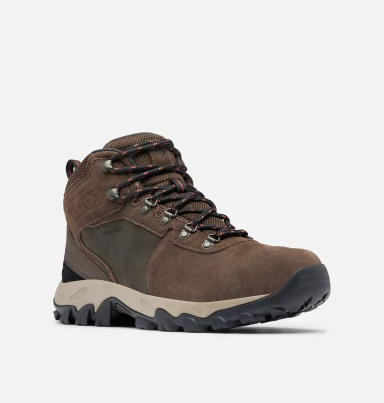 Columbia Newton Ridge Plus II Suede WP hiking boots in brown suede with waterproof design, metal eyelets, and rugged outsole, angled front view.