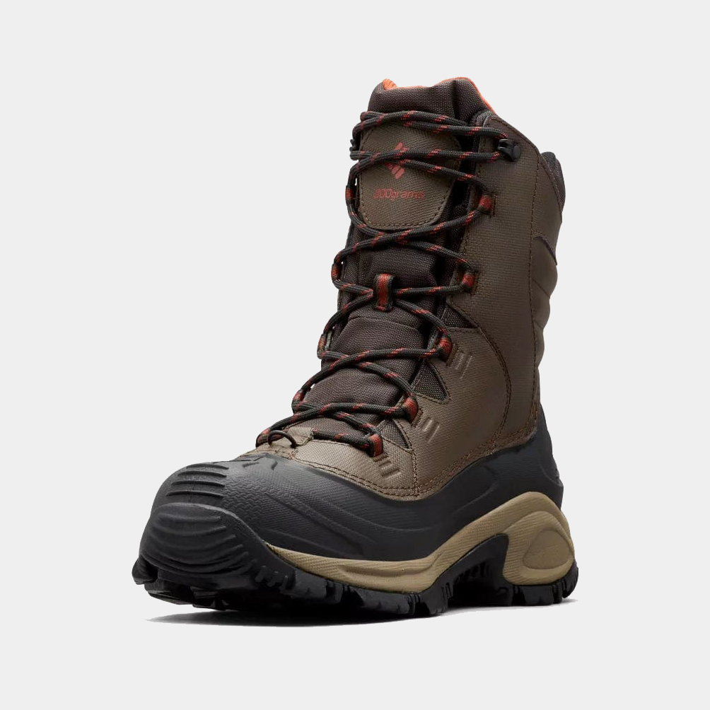 Columbia Bugaboot III winter boots in brown with rubber outsole, waterproof construction, and red-accented laces, angled front view.