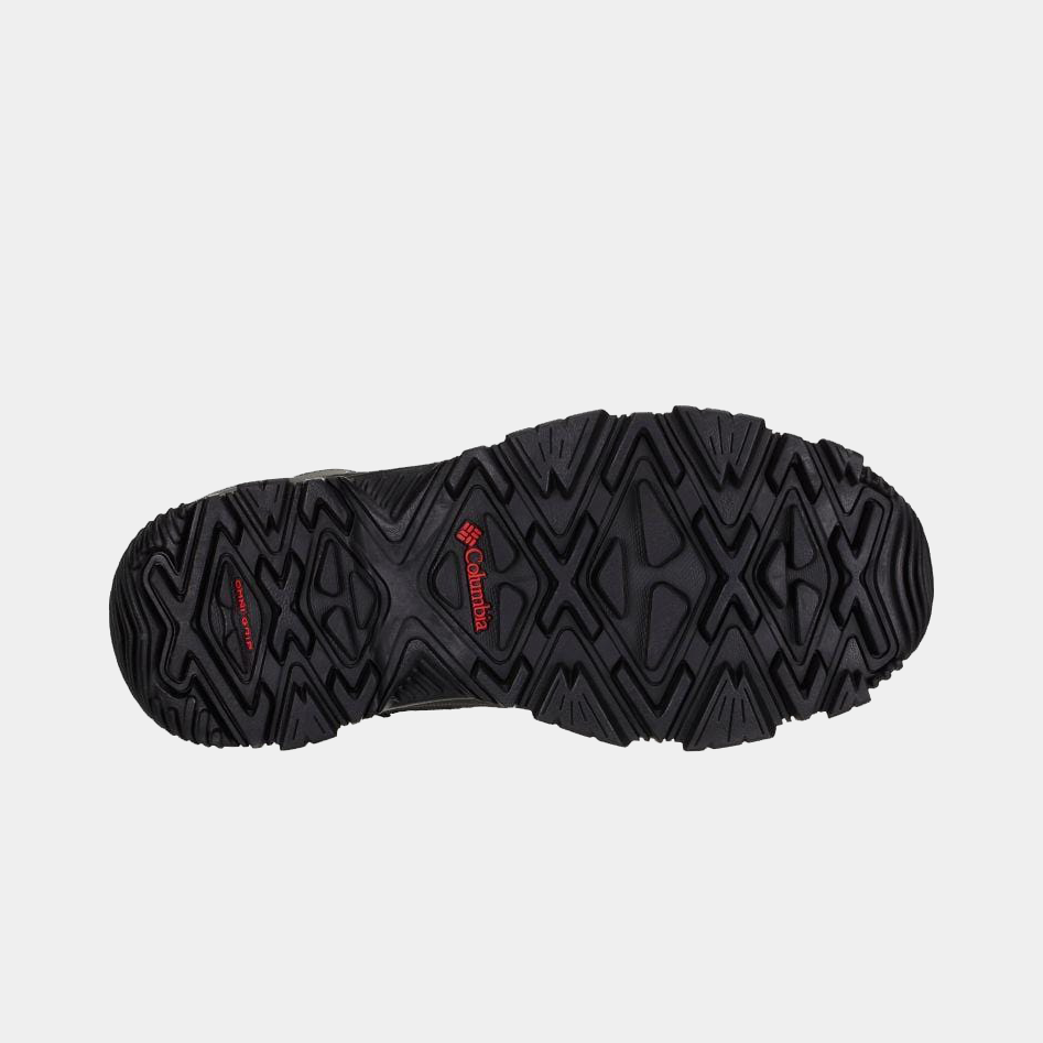 Columbia Bugaboot III winter boot outsole in black rubber with Omni-Grip traction and red logo detailing, bottom view.