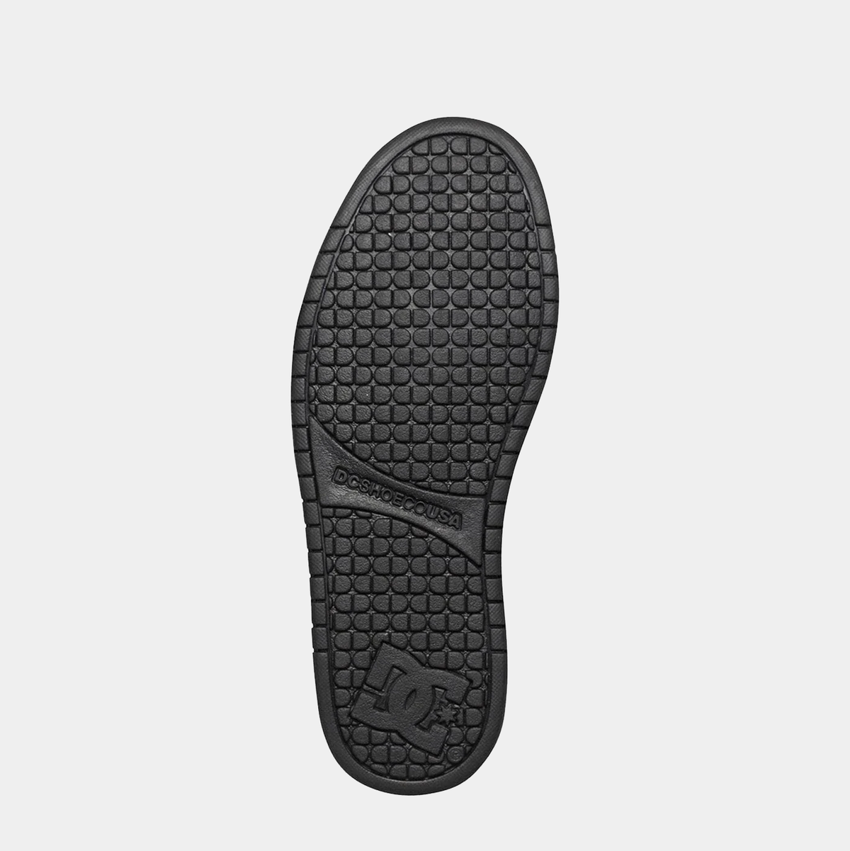 DC Footwear Court Graffik shoes outsole in black with textured tread pattern and DC logo, bottom view.