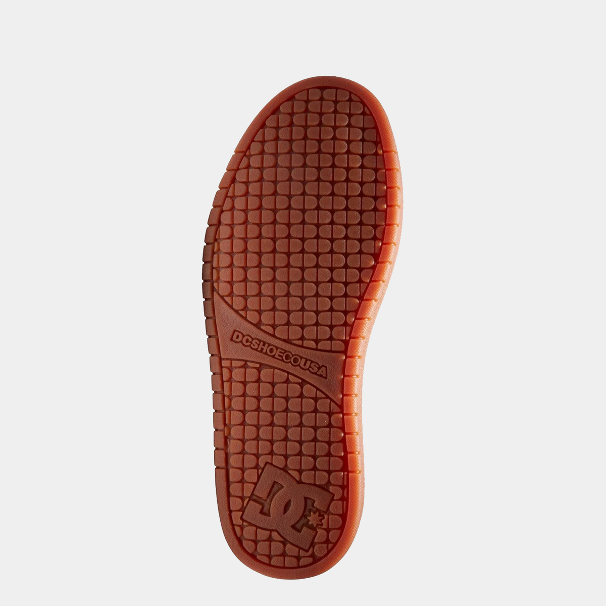 DC Footwear Court Graffik skate shoes outsole in orange showing textured grip pattern and DC branding.