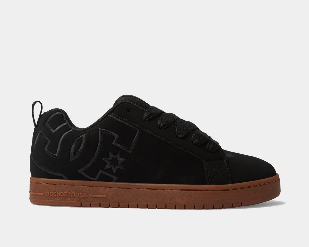 DC Footwear Court Graffik skate shoes in black with brown rubber outsole, side view showcasing logo detailing.