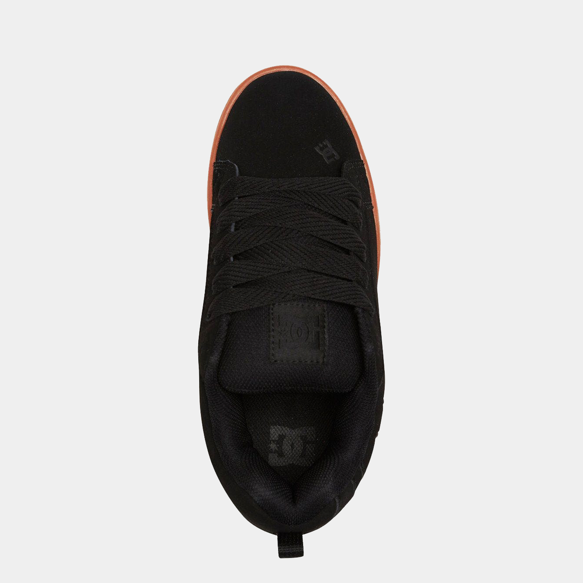 DC Footwear Court Graffik sneakers in black with signature logo accents and orange outsole, top view showing lace system and padded tongue.