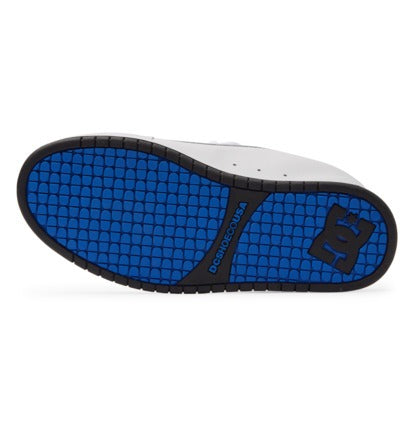 DC Footwear Court Graffik sneakers outsole featuring a textured blue and black grip pattern with logo detailing.