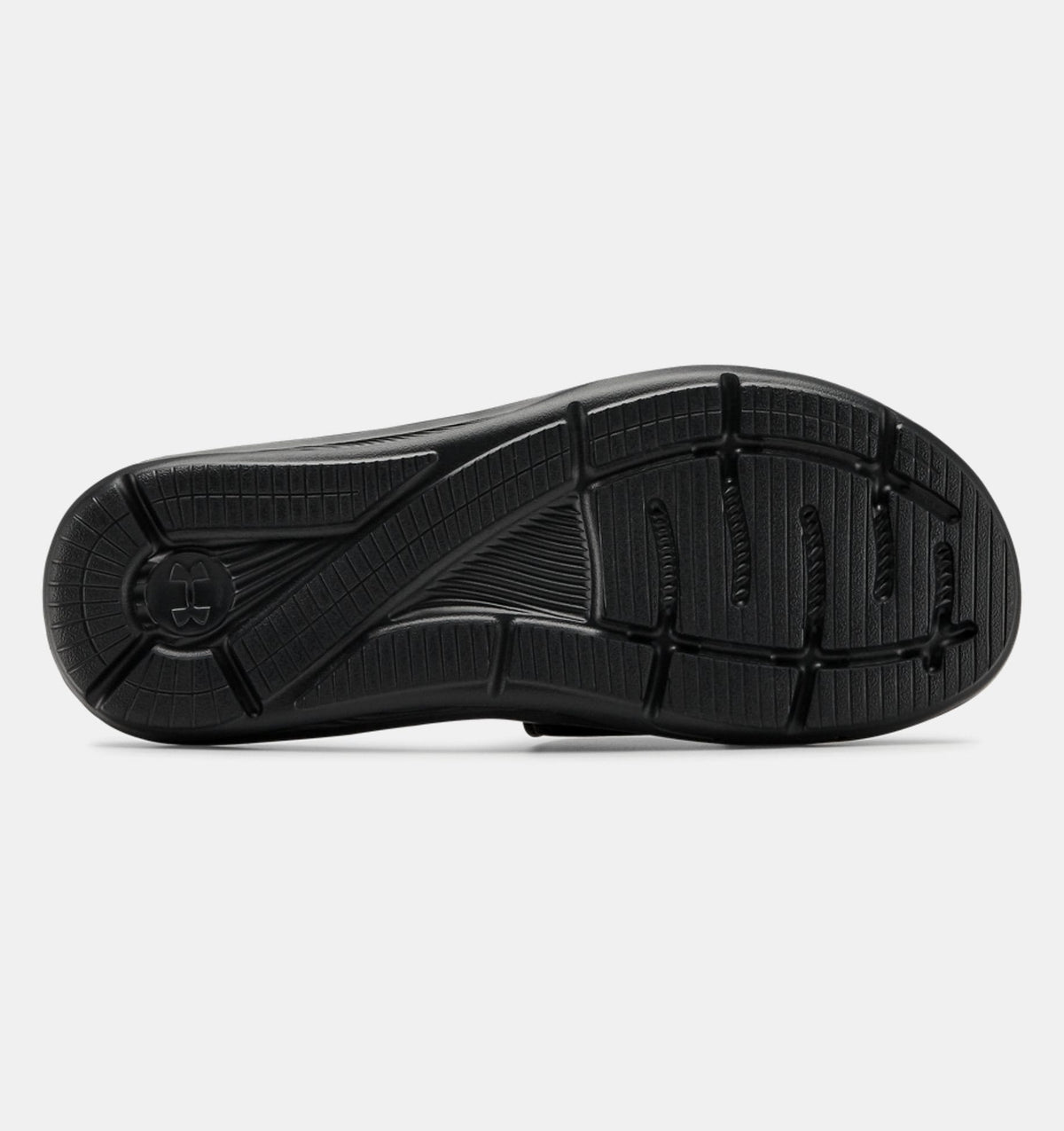 Under Armour Ignite VI SL sandal outsole in black with textured grip pattern and flex grooves, sole/bottom view.