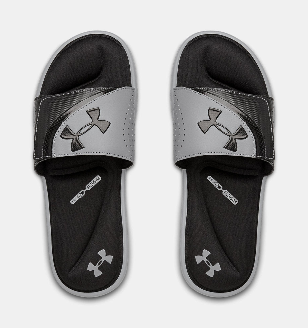 Under Armour Ignite VI SL slides in gray and black with perforated strap, foam cushioning, and logo detailing, top view.