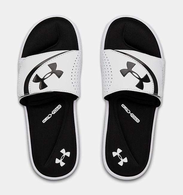 Under Armour Ignite VI SL slides in white with black cushioned footbed, perforated strap detailing, and bold logo design, top view.
