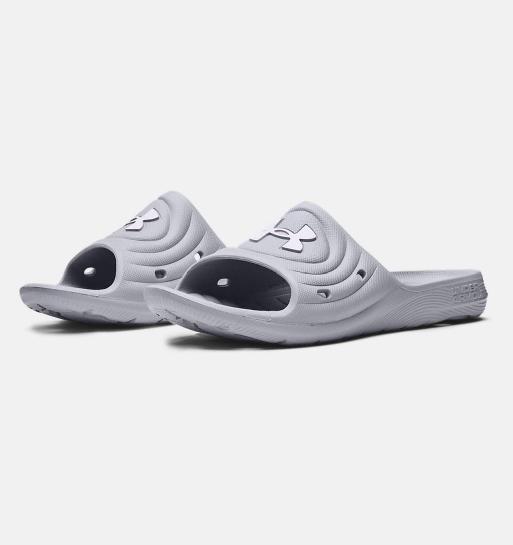 Under Armour Locker IV SL slides in light gray with textured synthetic upper, open-toe design, and durable outsole, angled front view.