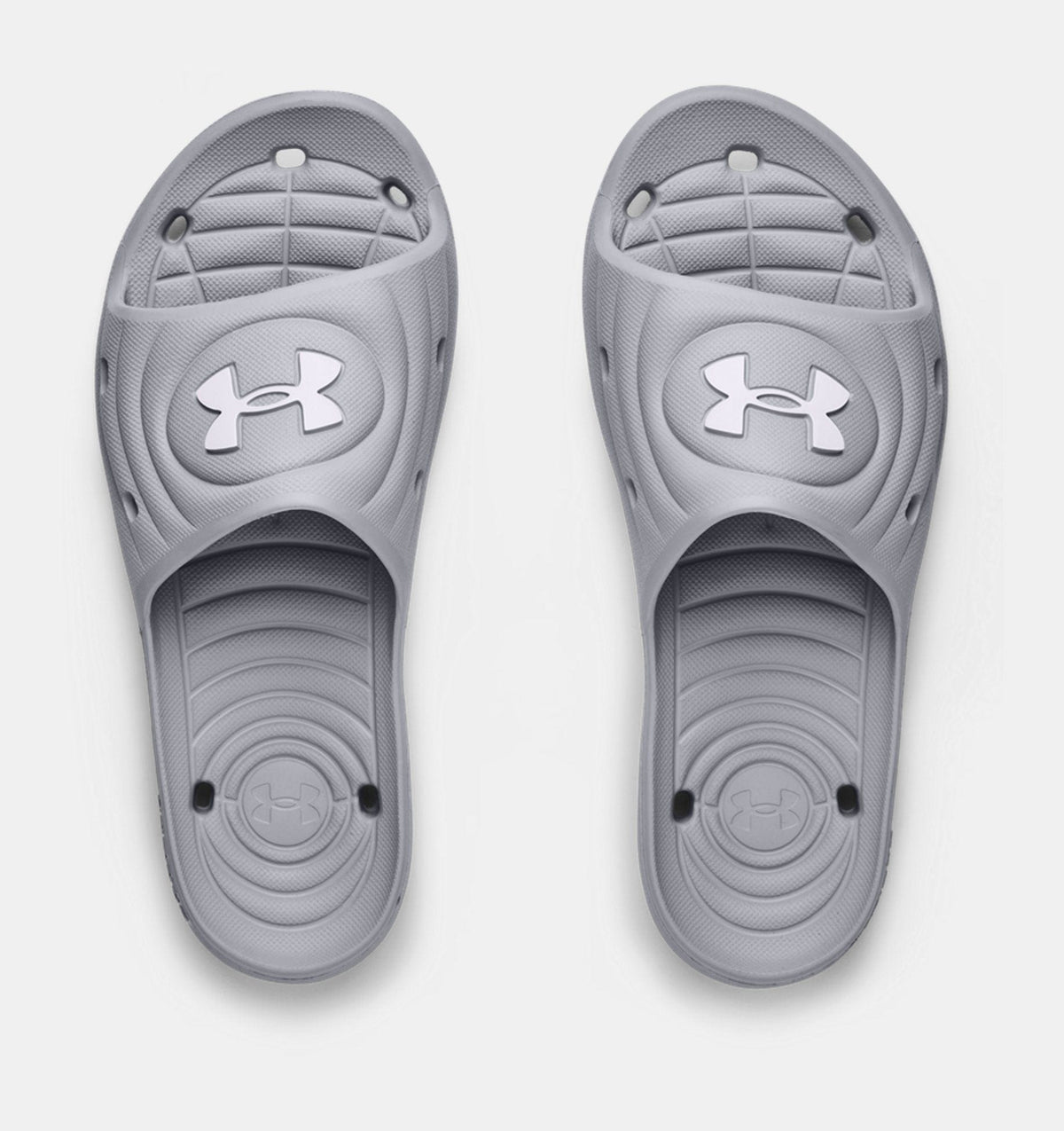 Under Armour Locker IV SL slides in gray with textured footbed, molded details, and logo accent, top view.