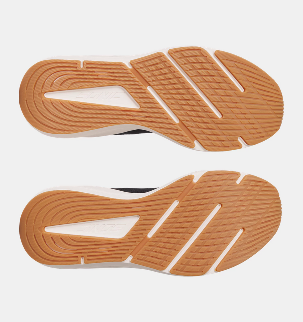 Under Armour HOVR Sonic 7 running shoes outsole showing grippy rubber tread pattern in orange and white, bottom view.