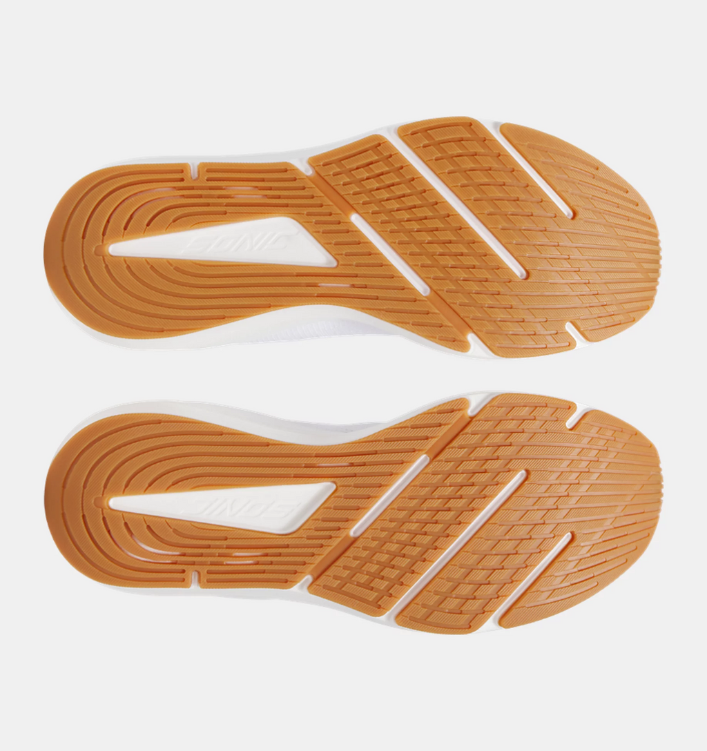 Under Armour HOVR Sonic 7 running shoes outsole with orange rubber traction pattern and flex grooves, bottom view.