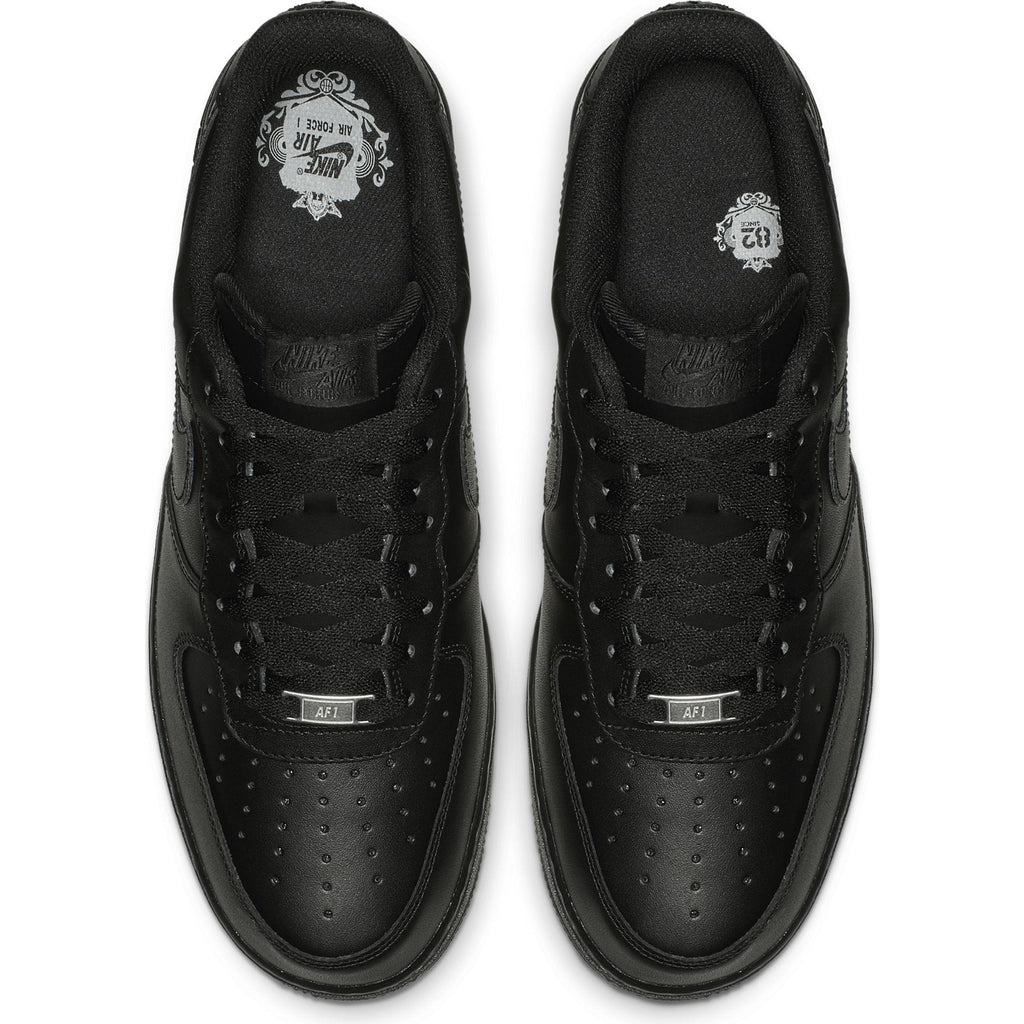 Nike Air Force 1 '07 sneakers in black leather with perforated toe box and lace detailing, top view.