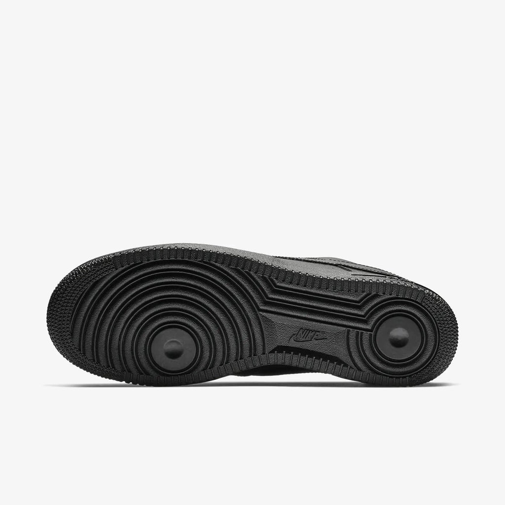 Nike Air Force 1 '07 sneakers outsole, black rubber with circular tread pattern for traction.