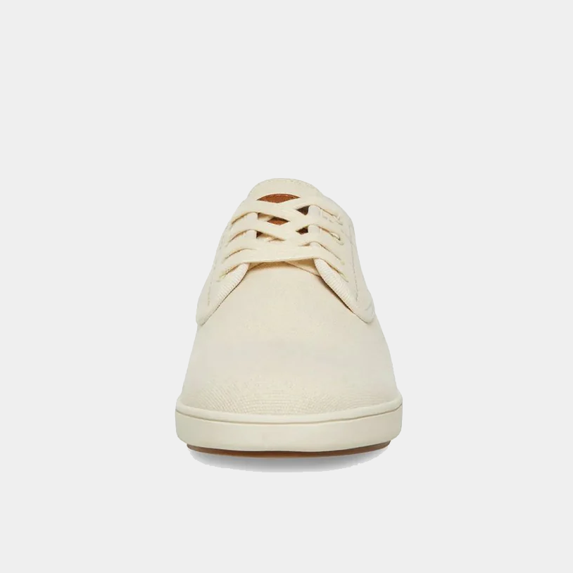 Steve Madden Fenta sneakers in cream canvas with lace-up closure and rubber sole, front view.