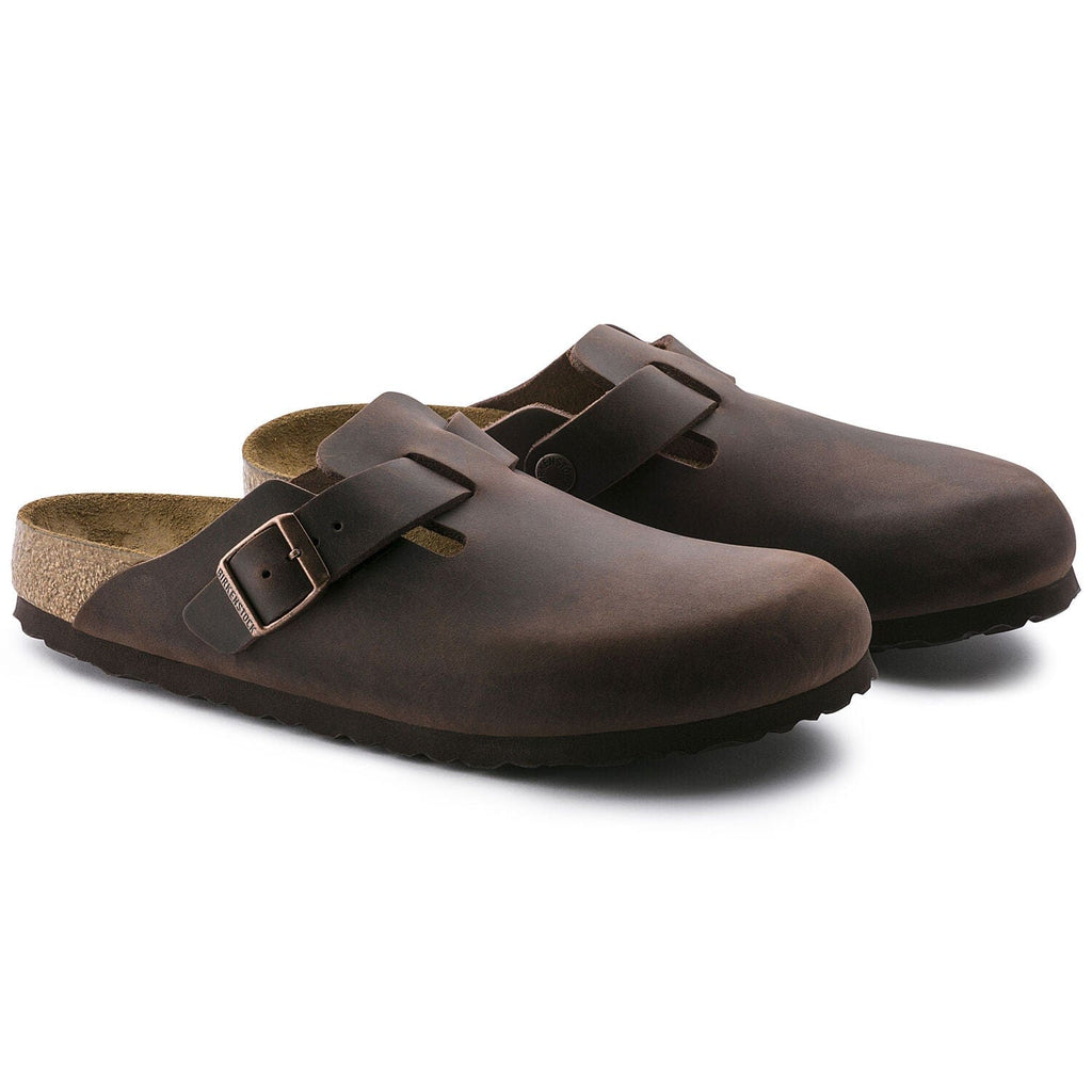 Birkenstock Boston Oiled Leather clogs in dark brown with adjustable buckle strap and contoured cork footbed, angled front view.