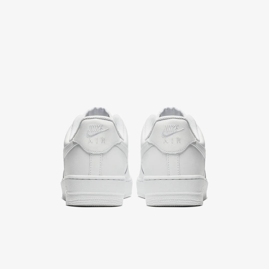 Nike Air Force 1 '07 sneakers in white leather with embossed Nike Air logo and padded heel counter, back view.