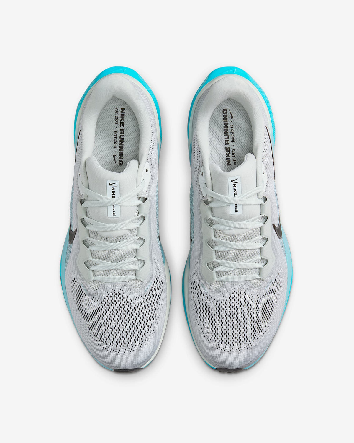 A pair of white Nike Air Zoom Pegasus 41 running shoes with black and blue accents and a black and white sole.