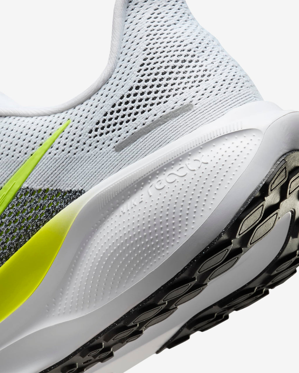 A pair of white Nike Air Zoom Pegasus 41 running shoes with yellow and grey  accents and a white and black sole.