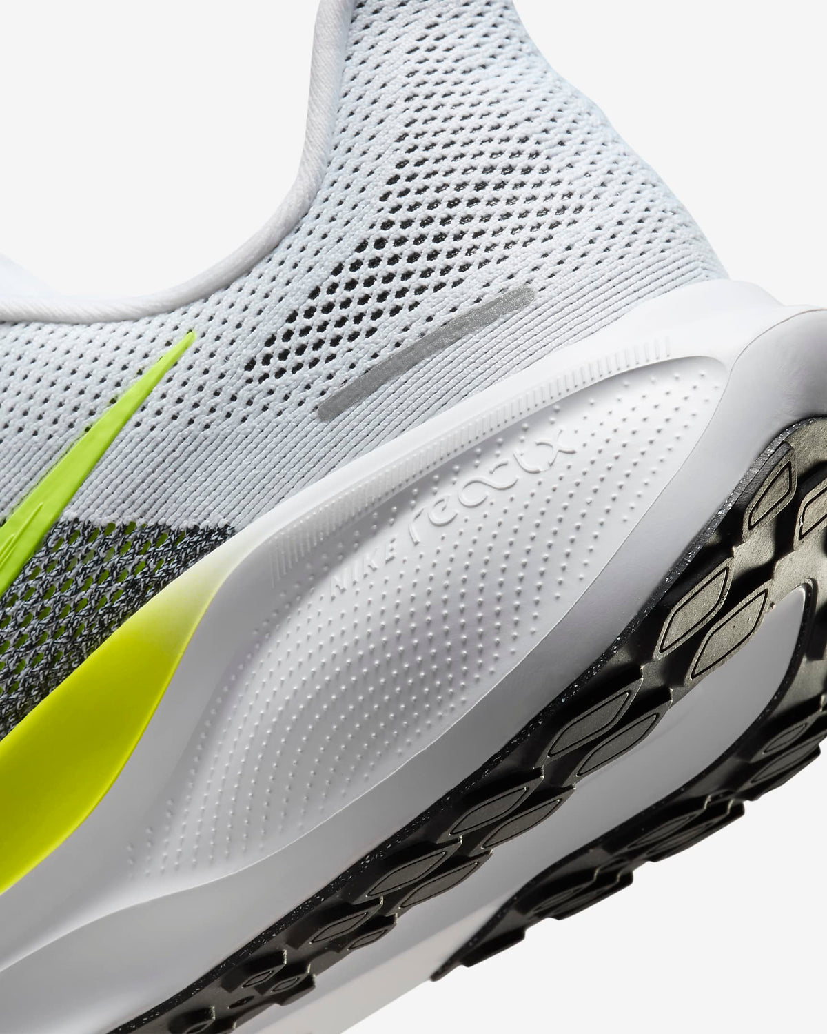 A pair of white Nike Air Zoom Pegasus 41 running shoes with yellow and grey  accents and a white and black sole.