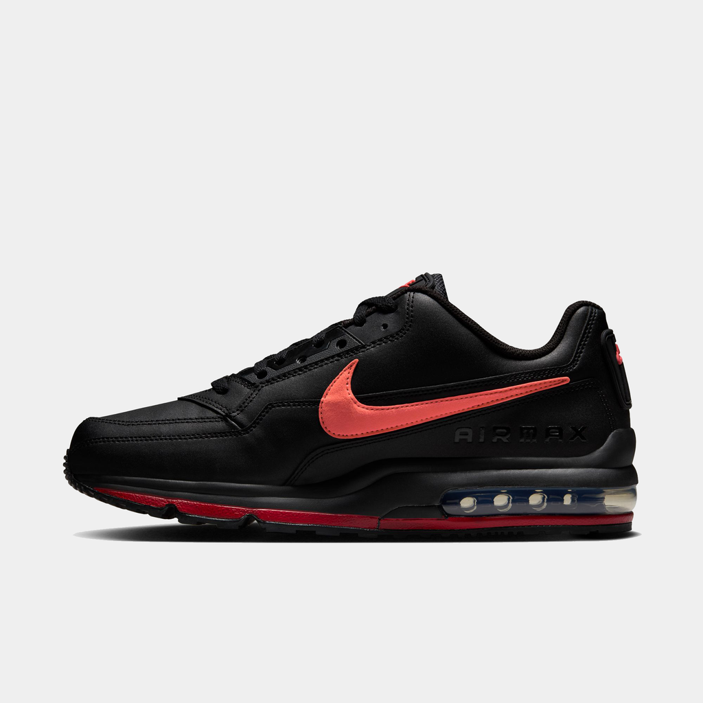 Black Nike Air Max sneaker with red swoosh logo on a light gray background