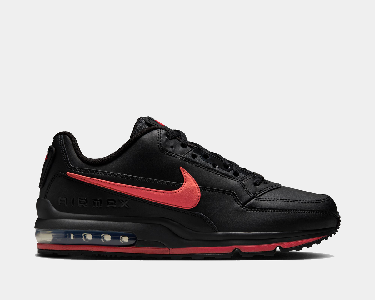 Black sneaker with red swoosh logo on a light gray background