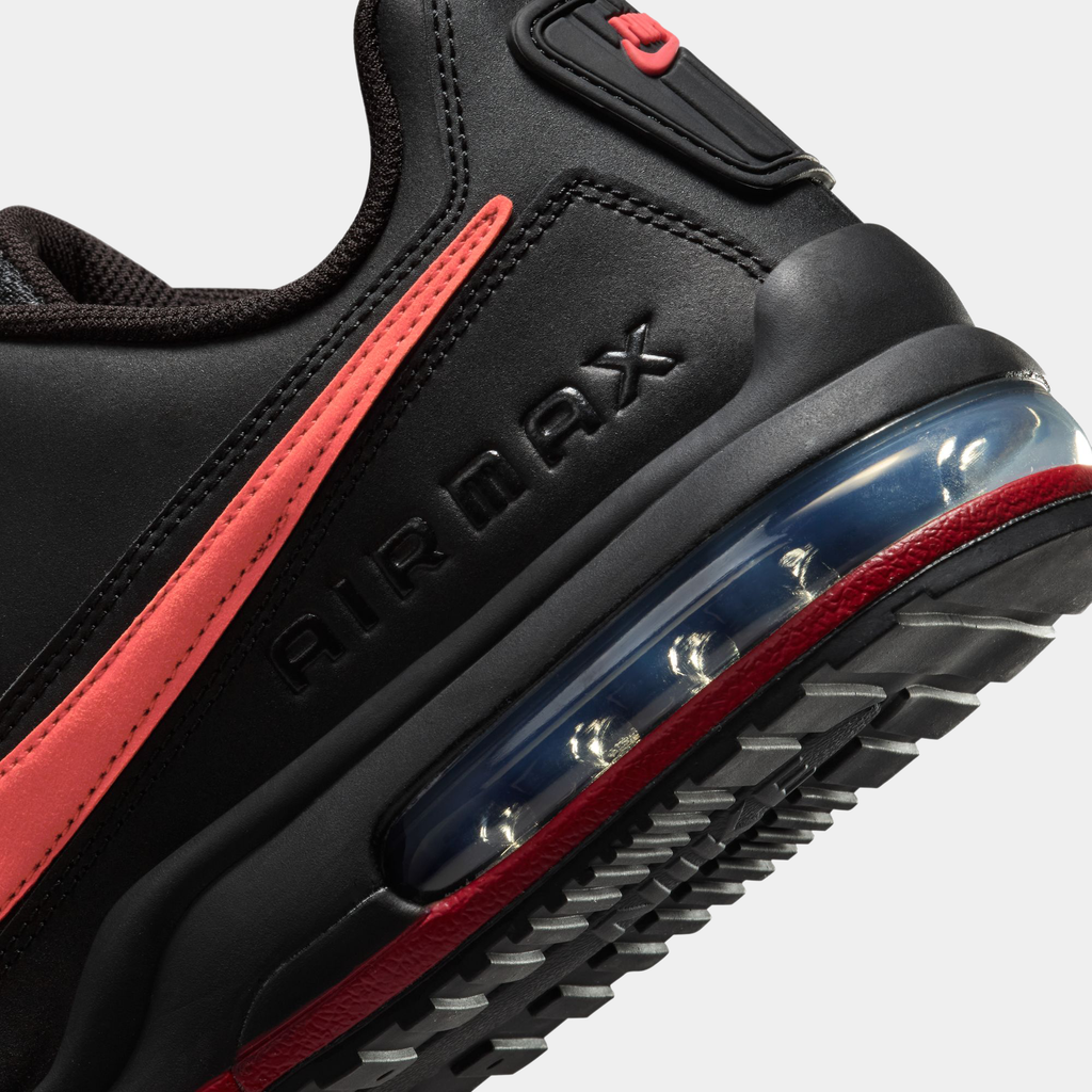 Black and red sneaker with 'Air Max' branding on a white background