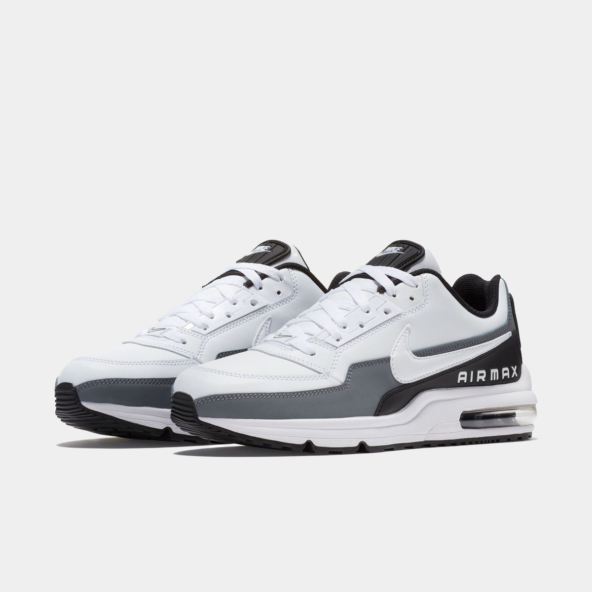 White and gray Air Max sneakers on a white background