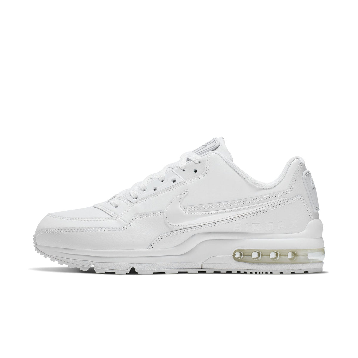 Nike Air Max LTD 3 sneaker featuring a white on white color scheme with leather upper, visible Max Air unit in the heel, and a rubber outsole.