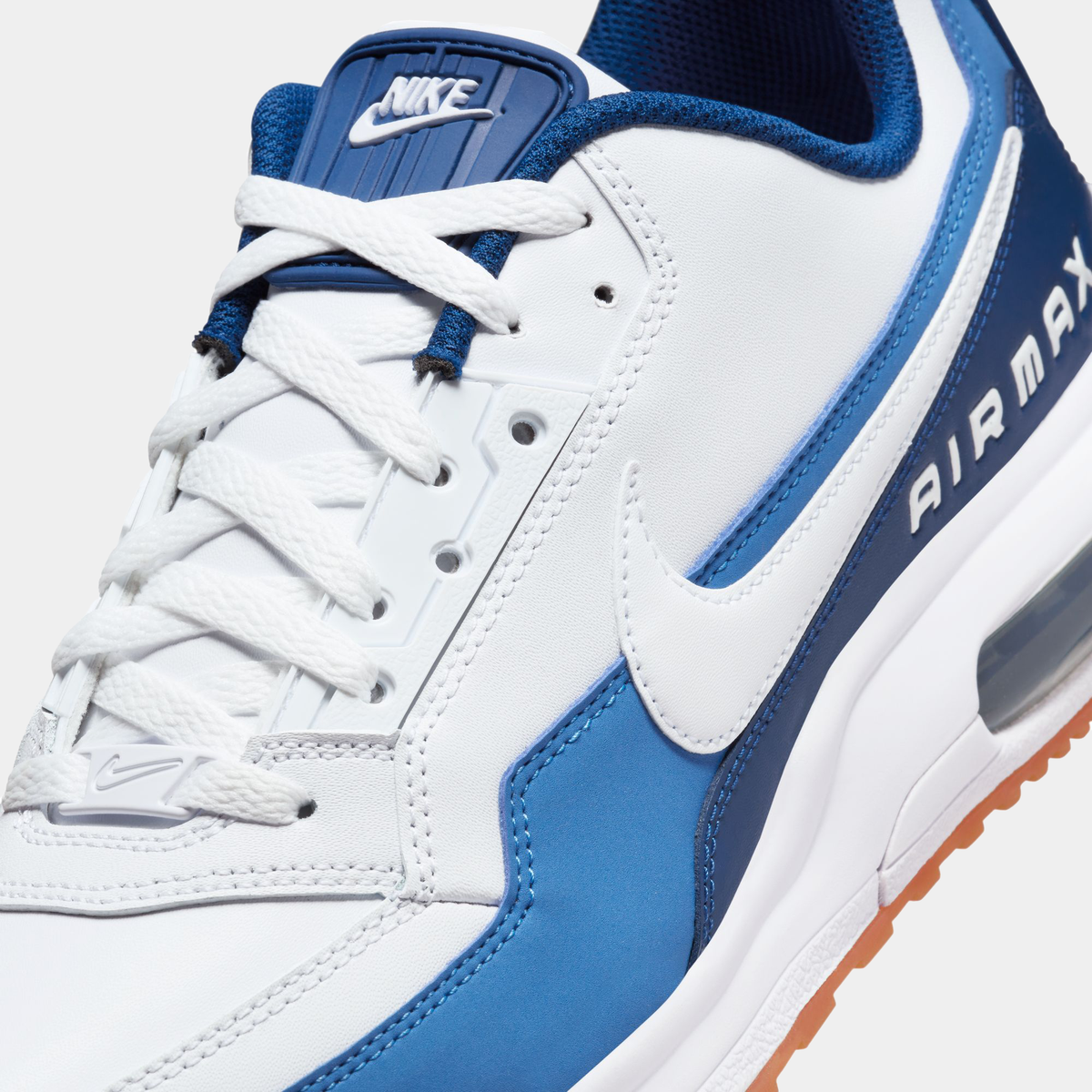 Nike Air Max LTD 3 sneaker featuring a white and blue color scheme with leather upper, visible Max Air unit in the heel, and a rubber outsole.