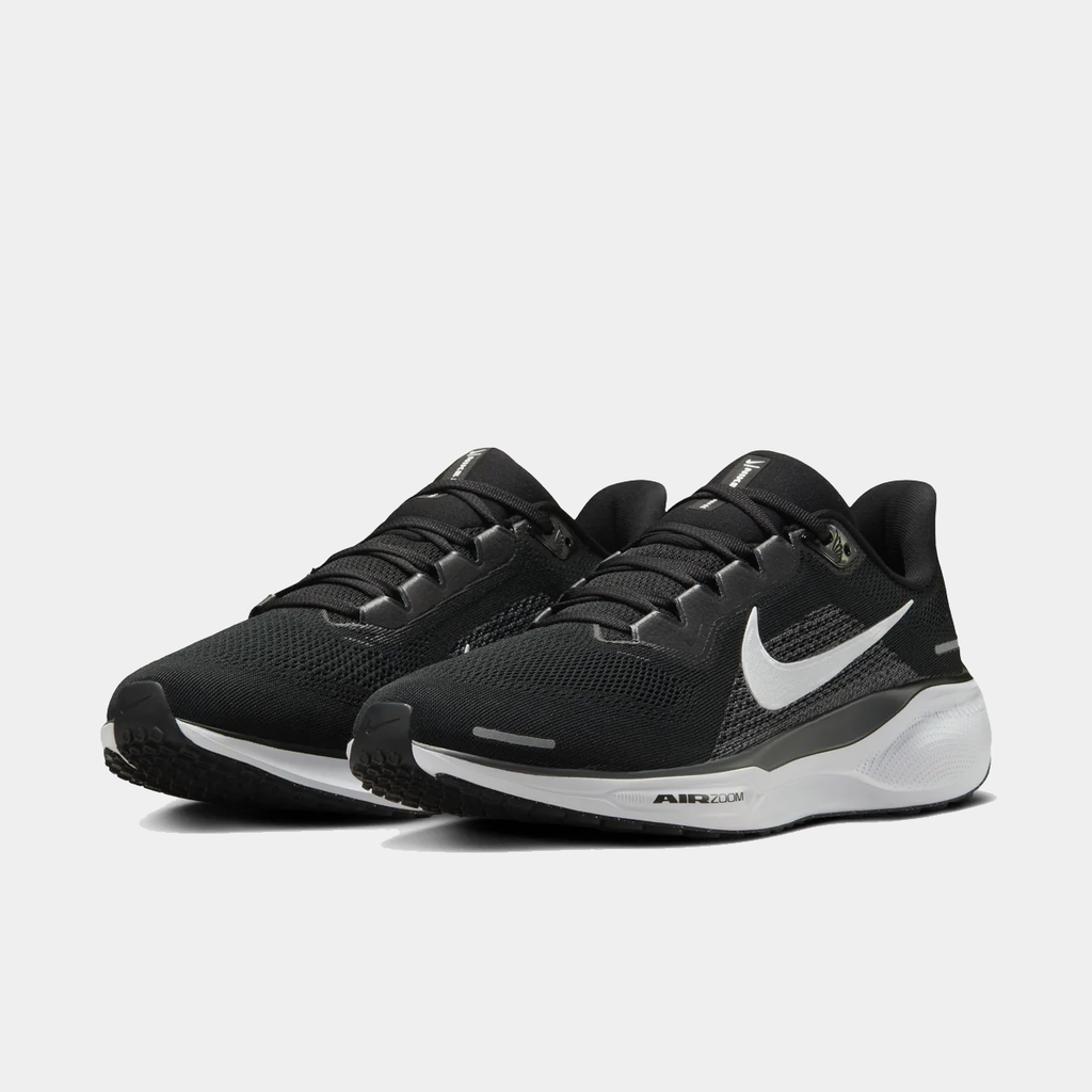 A pair of black and white Nike Air Zoom Pegasus 41 running shoes with red accents on a white background.