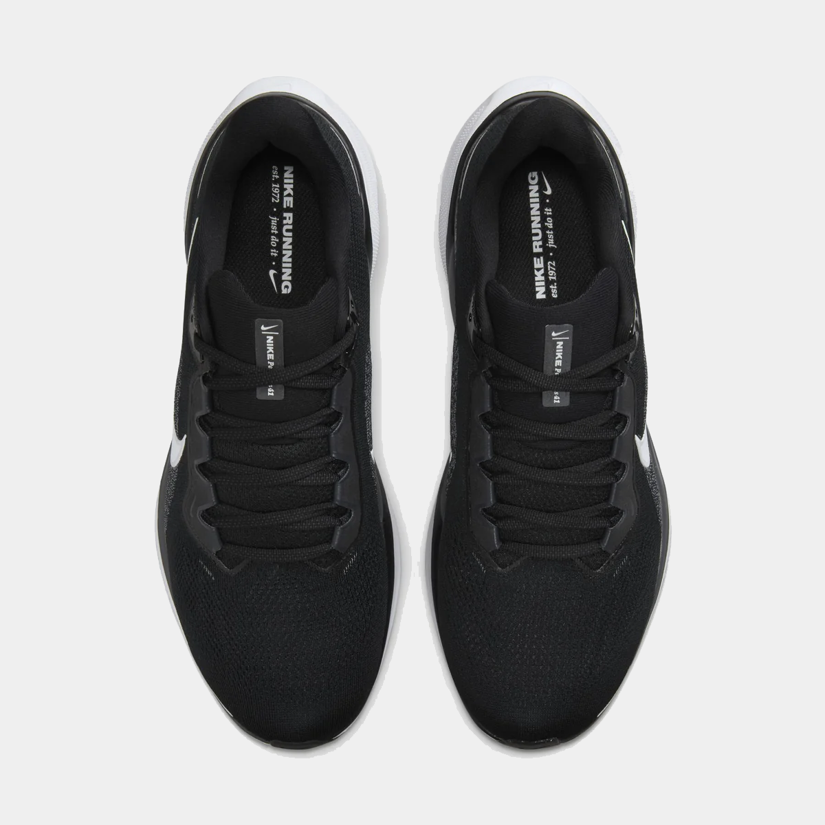 A pair of black and white Nike Air Zoom Pegasus 41 running shoes n a white background.