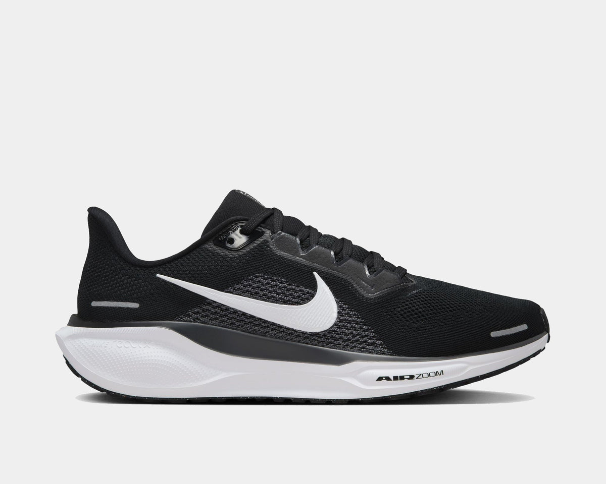 A pair of black and white Nike Air Zoom Pegasus 41 running shoes with red accents on a white background.