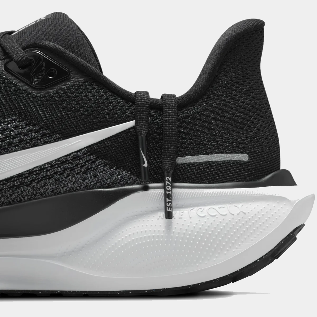 A pair of black and white Nike Air Zoom Pegasus 41 running shoes w on a white background.