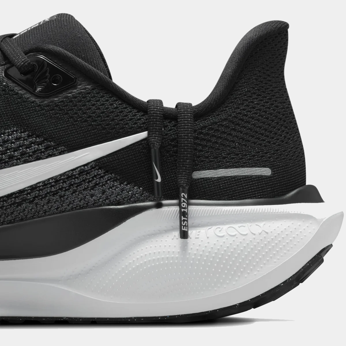 A pair of black and white Nike Air Zoom Pegasus 41 running shoes w on a white background.