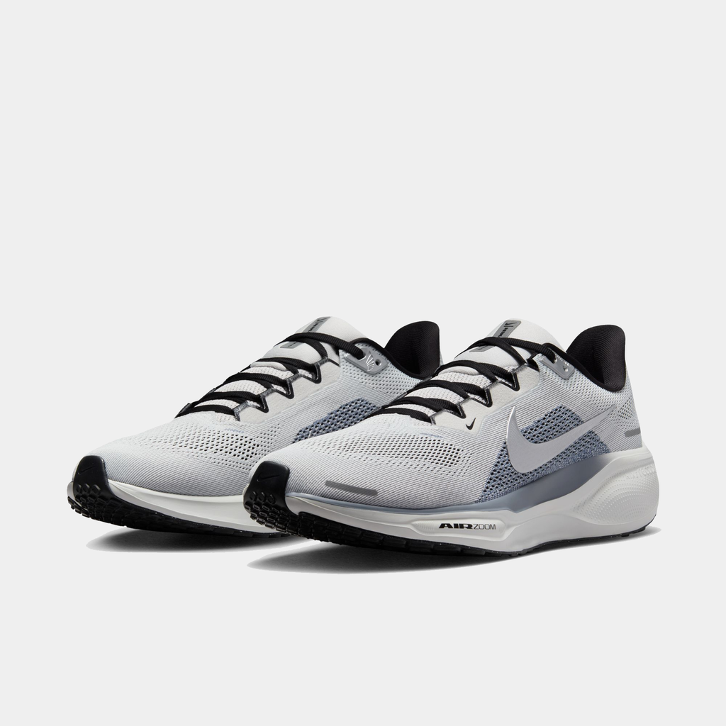 A pair of white and black Nike Air Zoom Pegasus 41 running shoes with a white and black sole.