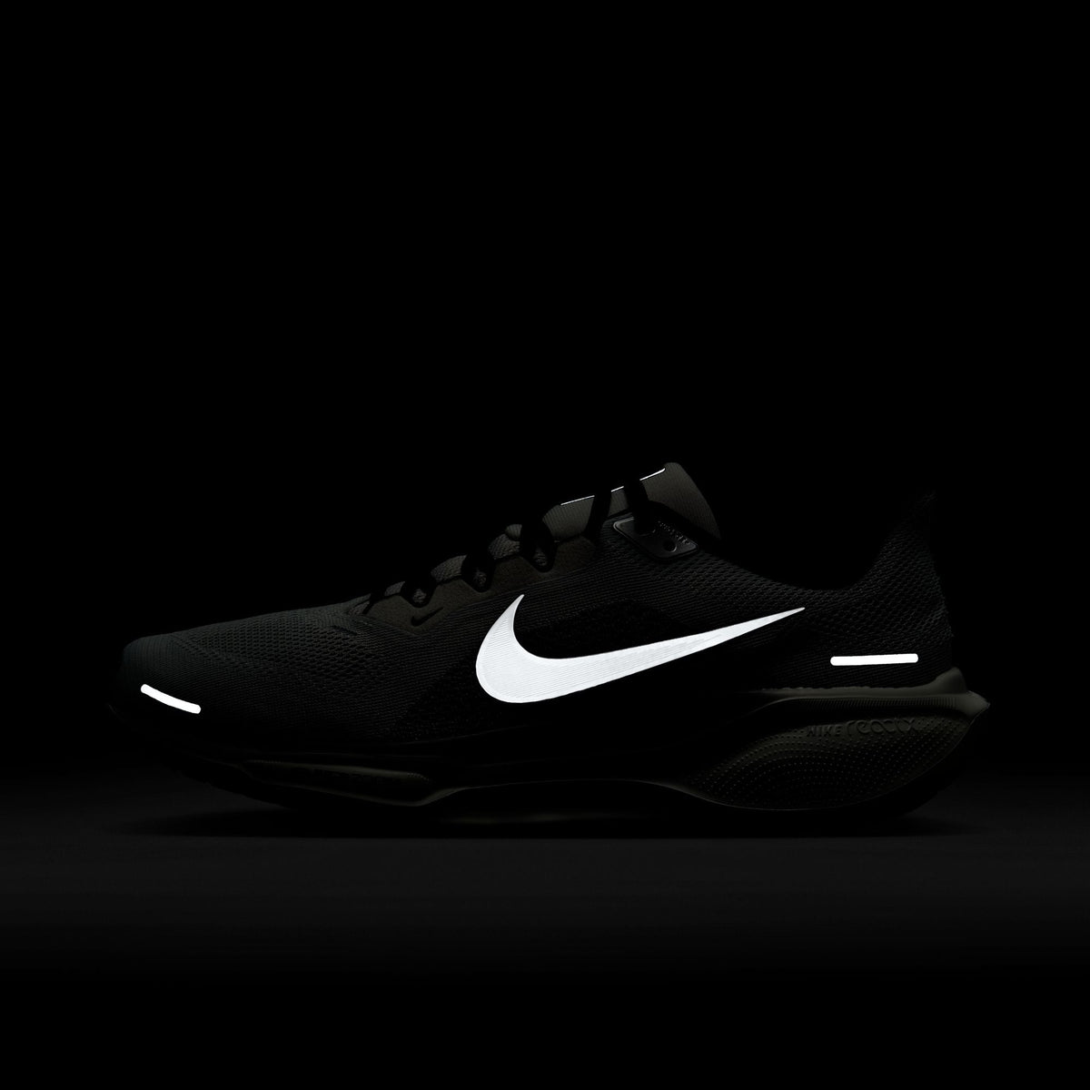 A pair of white and black Nike Air Zoom Pegasus 41 running shoes with a white and black sole.
