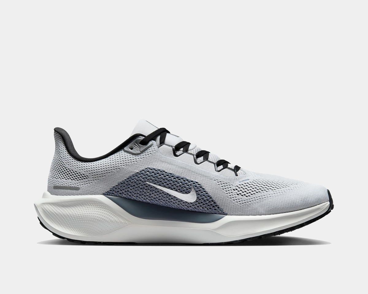 A pair of white and black Nike Air Zoom Pegasus 41 running shoes with a white and black sole.